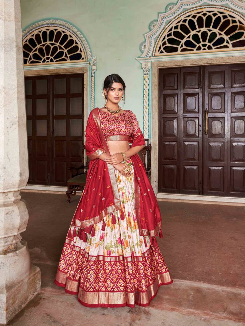 Fascinating White & Red Patola Printed Tussar Silk Lehenga Choli.
