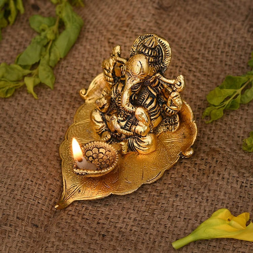 Metal Lord Ganesha on Leaf Idol with Diya (CS1411833)