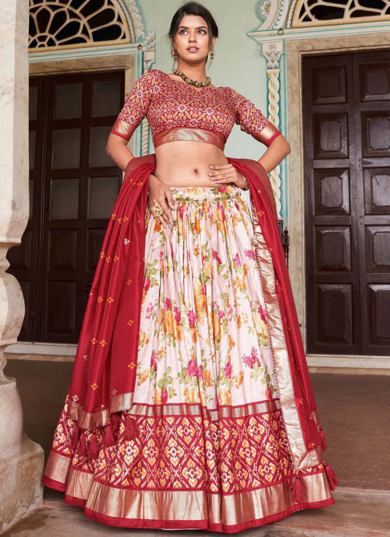 Fascinating White & Red Patola Printed Tussar Silk Lehenga Choli.