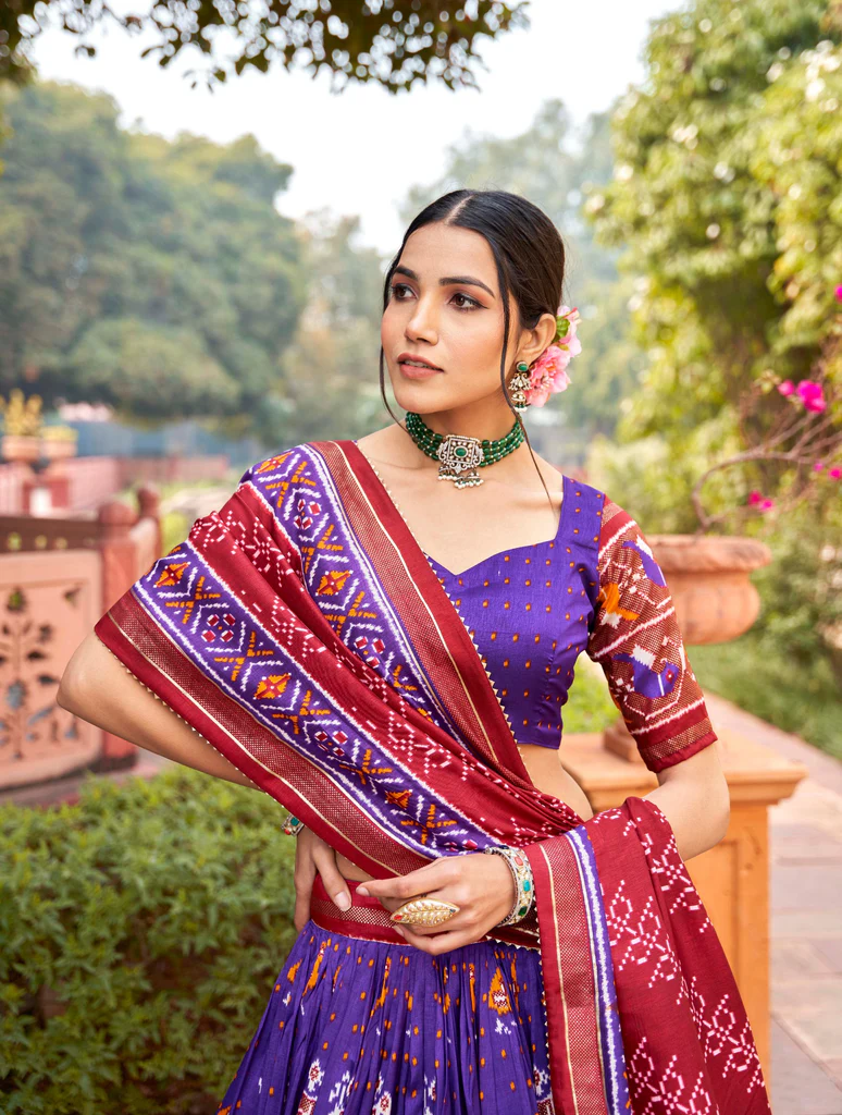 Purple Tussar Silk Lehenga Choli with Enchanting Ikat Patola Print and Foil Work.